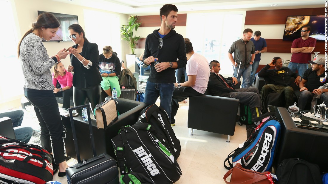 In the same lounge, Novak Djokovic is pictured surrounded by players&#39; racket bags -- a sizable piece of cargo to lug around the world.