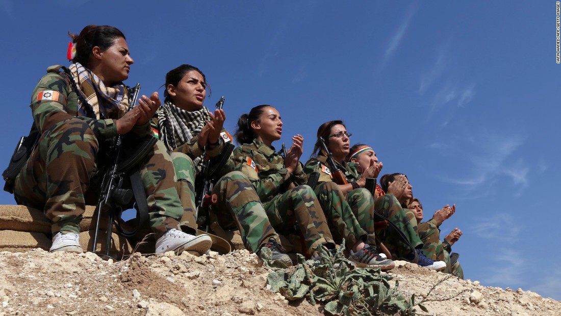 Female members of the Freedom Party of Kurdistan sing as they hold a position near Bashiqa on November 6.