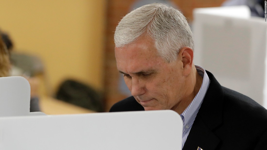 Trump&#39;s running mate, Indiana Gov. Mike Pence, votes in Indianapolis.