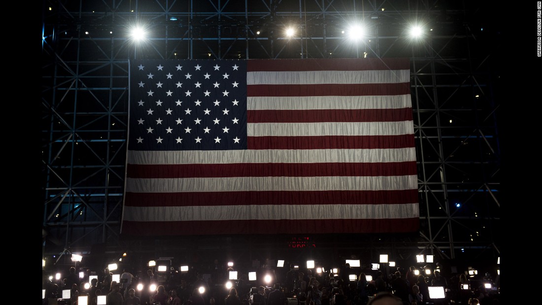 An American flag hangs above the media at the Javits Center.