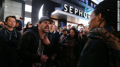 Trump and Clinton supporters argue outside Times Square