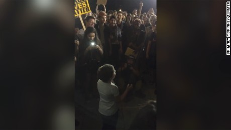 Young girl inspires protesters to chant with her 