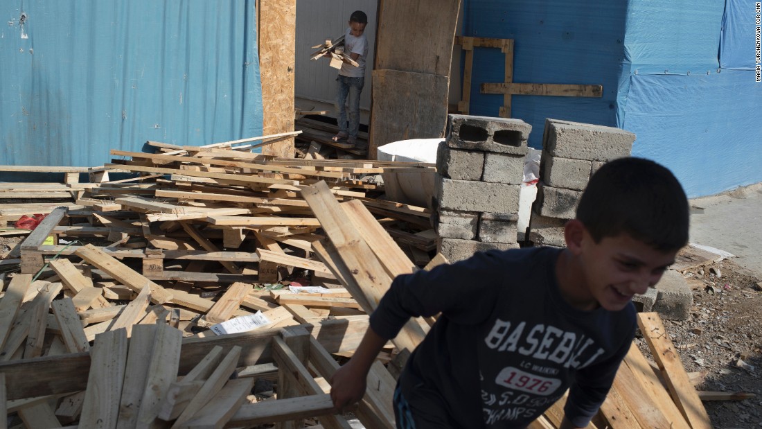 Boys help out in a carpentry shop at Ashti camp. The Christian families want to return home to rebuild, but many have lost hope for a decent future in Iraq.