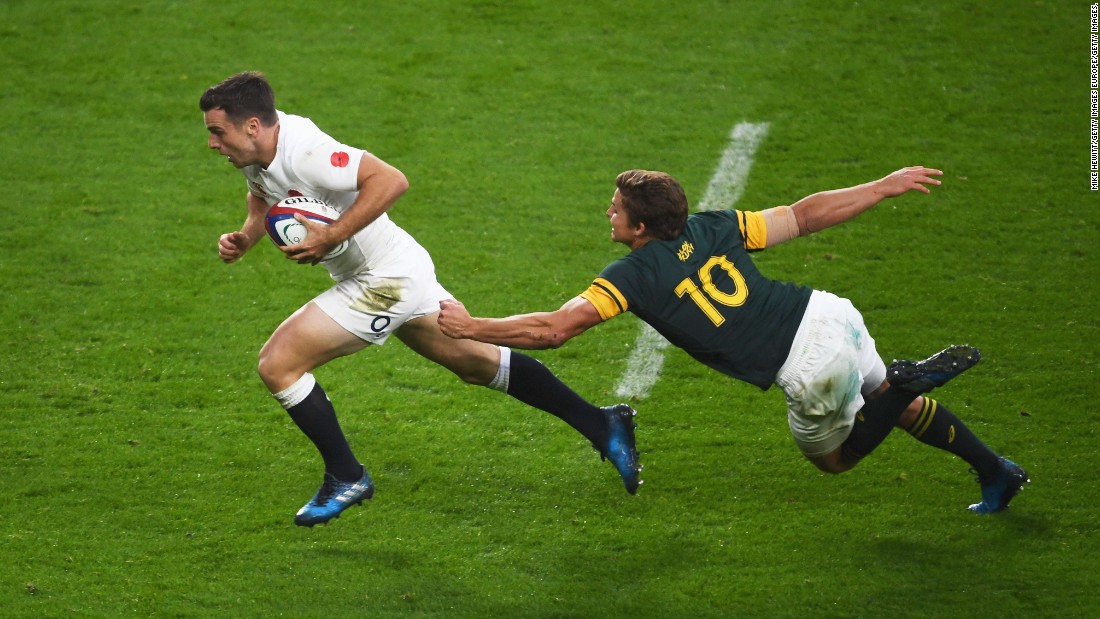 George Ford goes past a tackle by Pat Lambie of South Africa to score his team&#39;s third try at Twickenham.