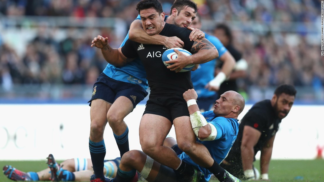 It takes two to bring down Codie Taylor of the New Zealand All Blacks.