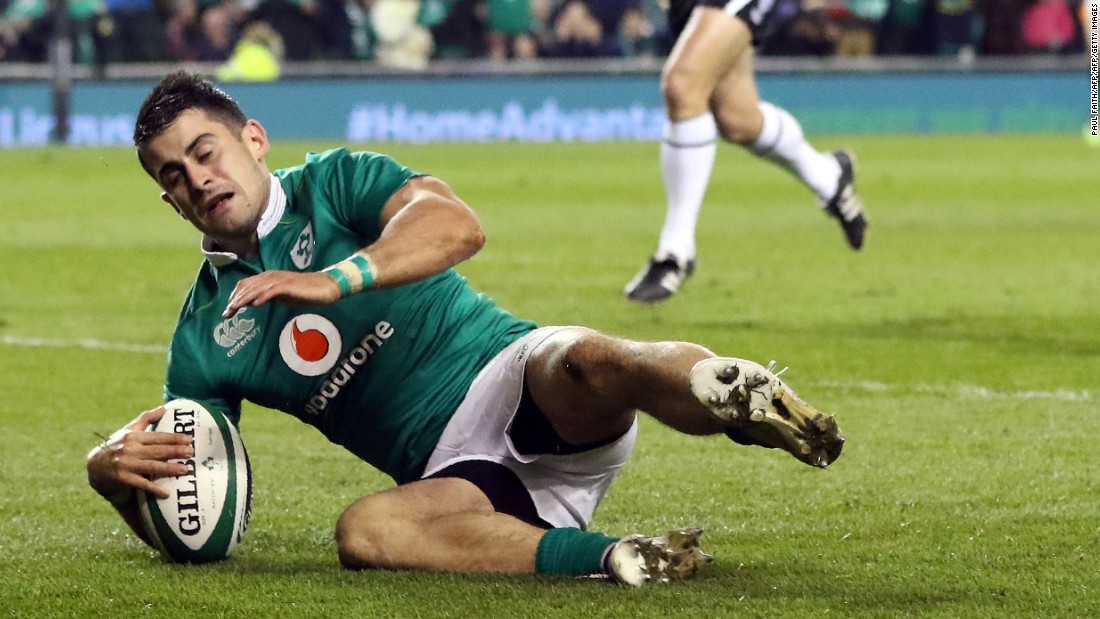 Ireland&#39;s full-back Tiernan O&#39;Halloran scores his team&#39;s third try during the contest with Canada.