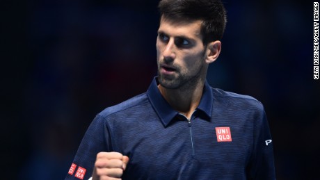 Serbia&#39;s Novak Djokovic celebrates a point against Austria&#39;s Dominic Thiem on his way to victory in his ATP World Tour Finals opener.