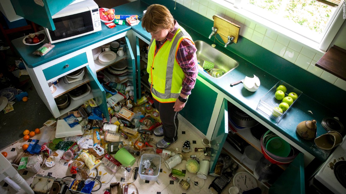 Mary Kimber surveys the damage in her kitchen after the quake in Waiau on November 14.