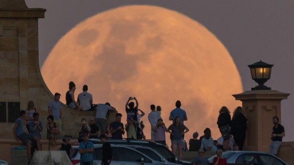 Crowds in Fremantle, Australia, look at the supermoon on Monday, November 14. NASA scientists say the moon is brighter than it has appeared at any point in the last 68 years.