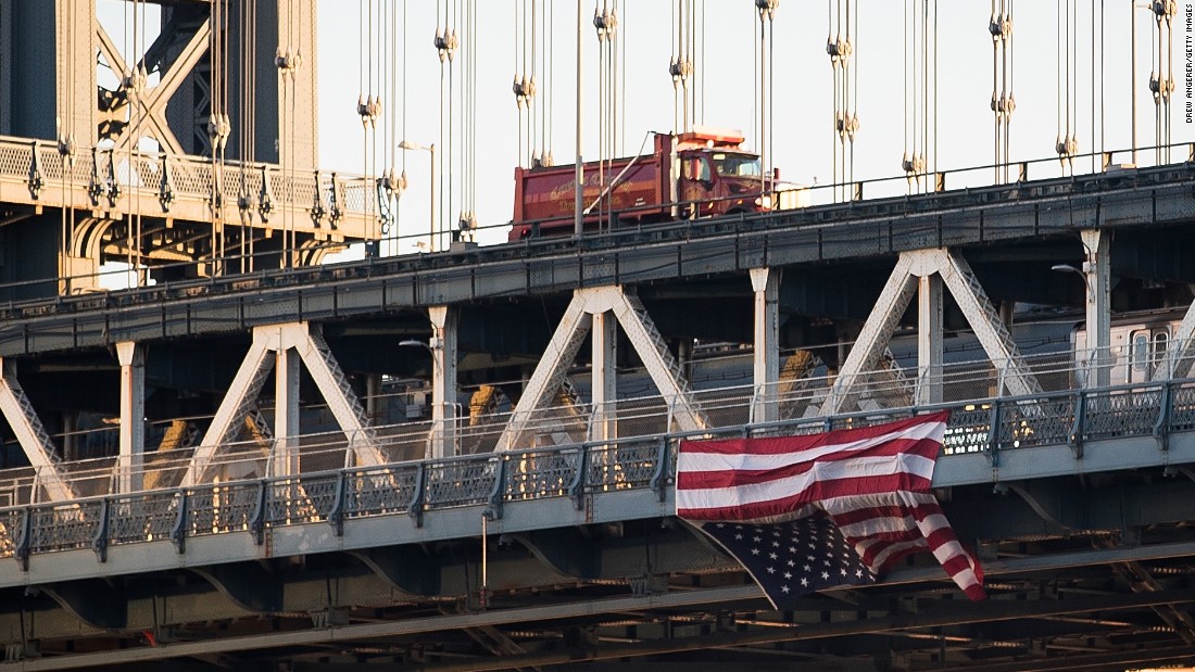 Anti-Trump protesters in New York hung an upside-down American flag from the side of the Manhattan Bridge on November 14.