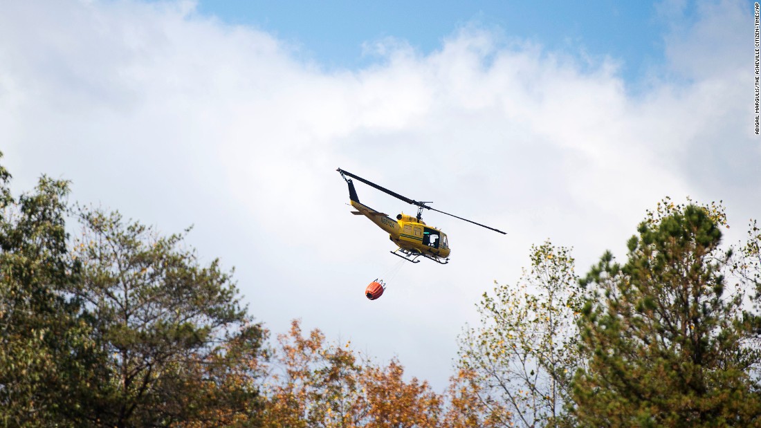 A helicopter carrying 240 gallons of water takes off in Lake Lure, North Carolina, on November 10.