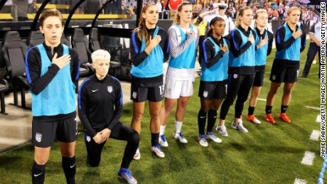 Megan Rapinoe of the US Women&#39;s team kneels during the playing of the national anthem. 