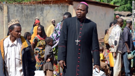 Dieudonne Nzapalainga meets Muslims who fled militia attacks at a center for displaced people in 2014.