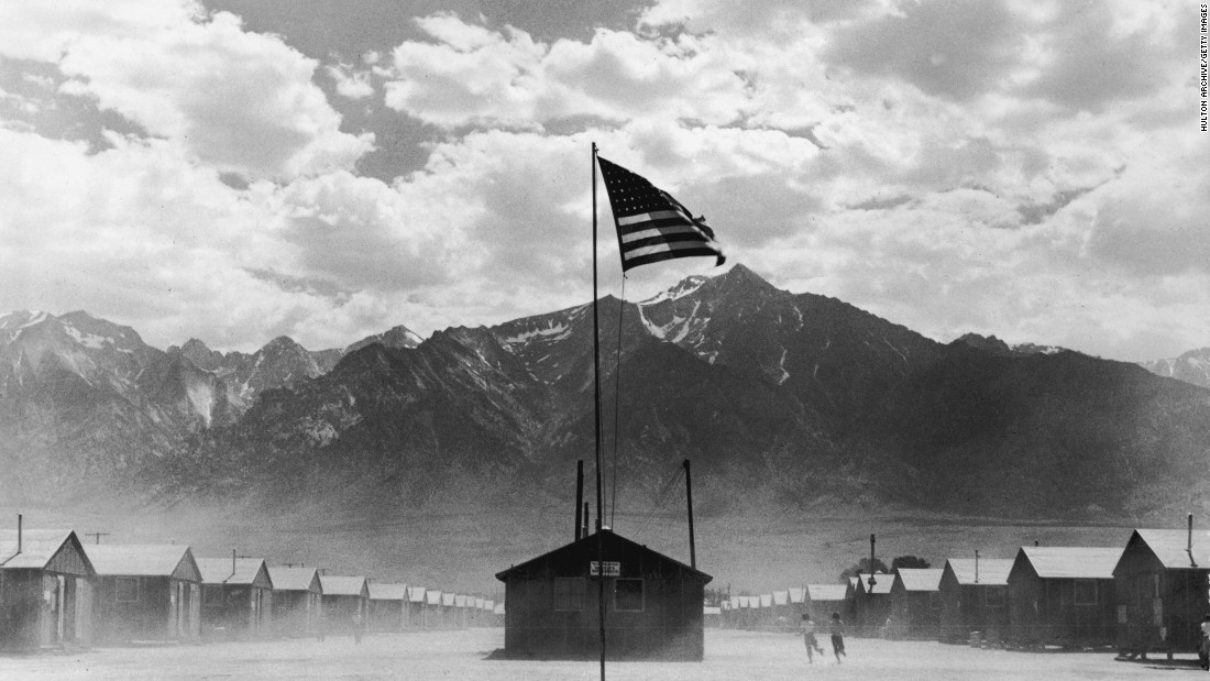 A US flag flies at a Japanese-American internment camp, circa 1942