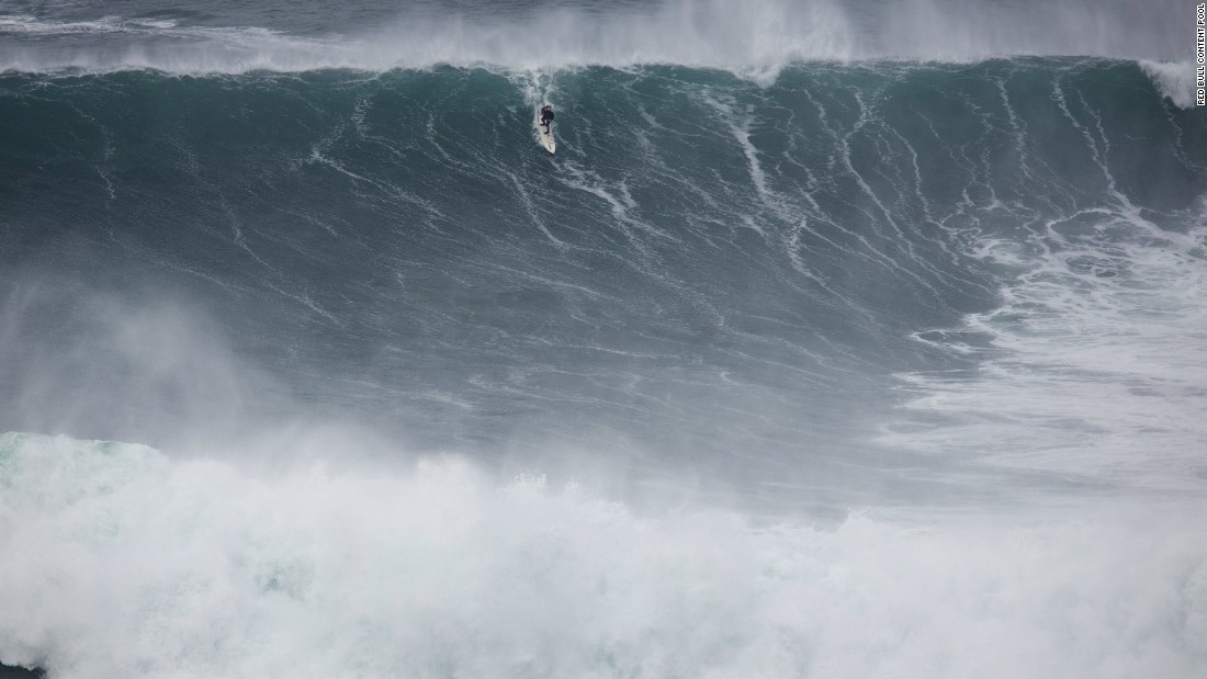 He admits there are dangers to big wave surfing and says he feels fear every time it comes to tackle the monstrous swells -- such as this one at Praia do Norte in Nazaré, Portugal.