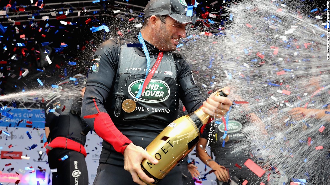 Sailing legend Ainslie celebrates victory with team Land Rover BAR at the America&#39;s Cup World Series in Portsmouth, England, in July.