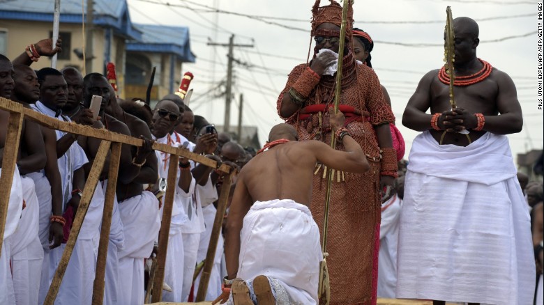 A palace aide kneels down before newly crowned Monarch. Kingship as an institution is much more than a ceremony hence the kingdom's strict and largely uncompromising adherence to ancient customs and traditions.