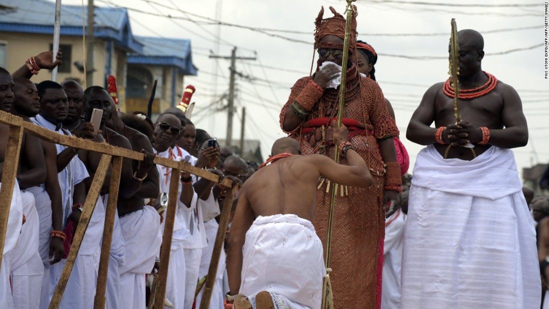 A palace aide kneels down before newly crowned Monarch. Kingship as an institution is much more than a ceremony hence the kingdom&#39;s strict and largely uncompromising adherence to ancient customs and traditions.