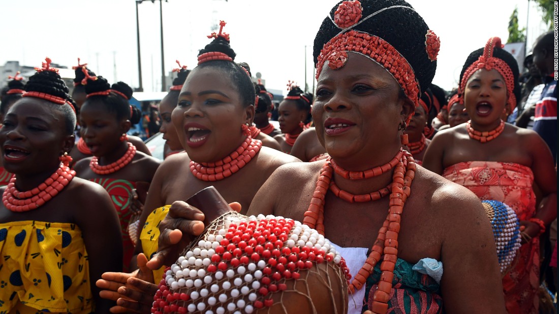 Dancers perform during the ceremony. In the final part of the journey the king is led to the ancient town of Isekhere. 