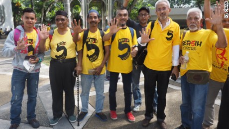 Protesters in yellow T-shirts gather Saturday in Kuala Lumpur to march against Malaysia&#39;s government.