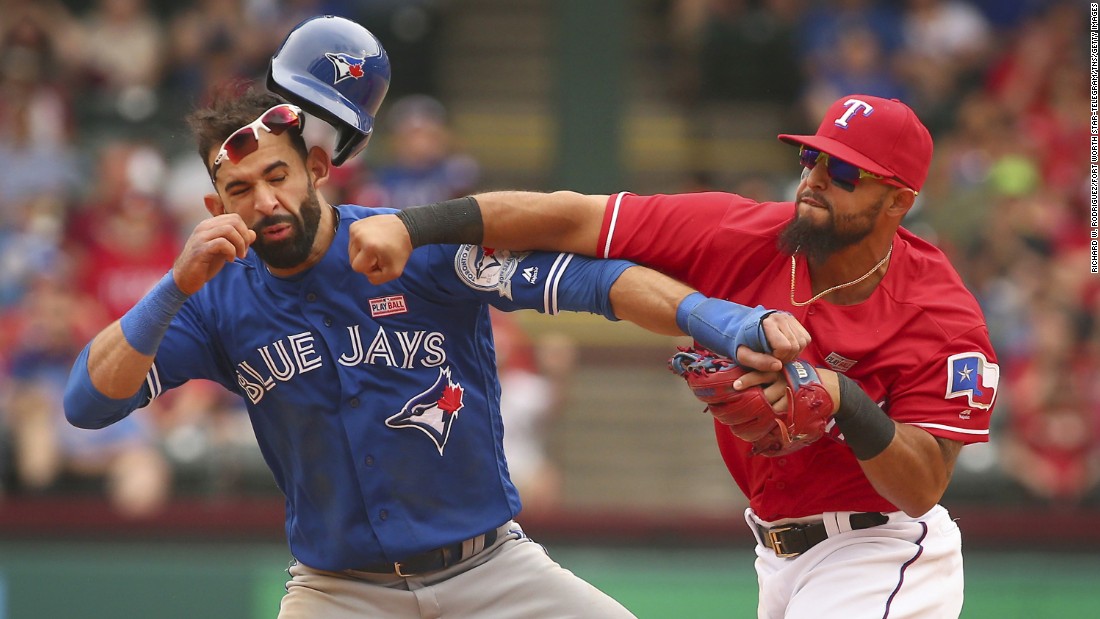 Texas second baseman Rougned Odor, right, punches Toronto outfielder Jose Bautista during a Major League Baseball game in Arlington, Texas, on Sunday, May 15. The confrontation, &lt;a href=&quot;http://bleacherreport.com/articles/2640341-jose-bautista-rougned-odor-and-more-ejected-after-blue-jays-vs-rangers-brawl&quot; target=&quot;_blank&quot;&gt;which sparked a bench-clearing brawl,&lt;/a&gt; came after the base-running Bautista slid hard into second to try to break up a double play. Both players were ejected, as were several others involved in the brawl afterward.