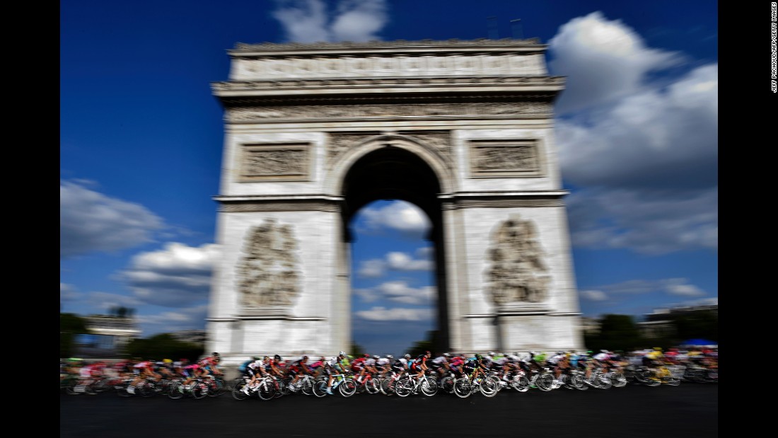 Cyclists race past the Arc de Triomphe in Paris during the last stage of the Tour de France on Sunday, July 24.