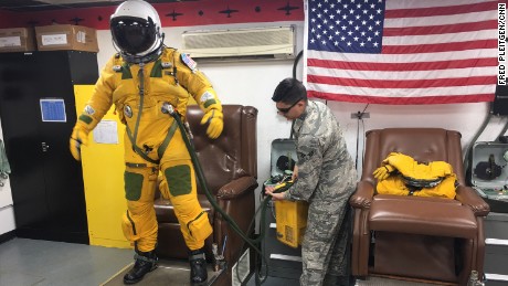 U2 pilots wear flight suits and helmets similar to those worn by astronauts.