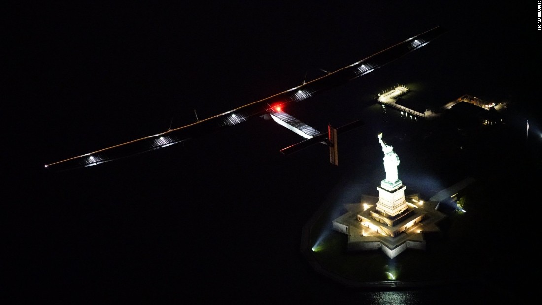 The plane crosses over the Statue of Liberty in New York, the final leg in the United States.