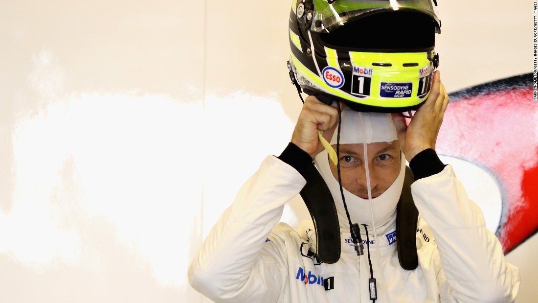 Jenson Button putting on his race helmet for the last time -- the British driver wore the livery of the Brawn team from his championship-winning year in 2009. He was forced to retire on the 12th lap, but McLaren teammate Fernando Alonso finished 10th.  