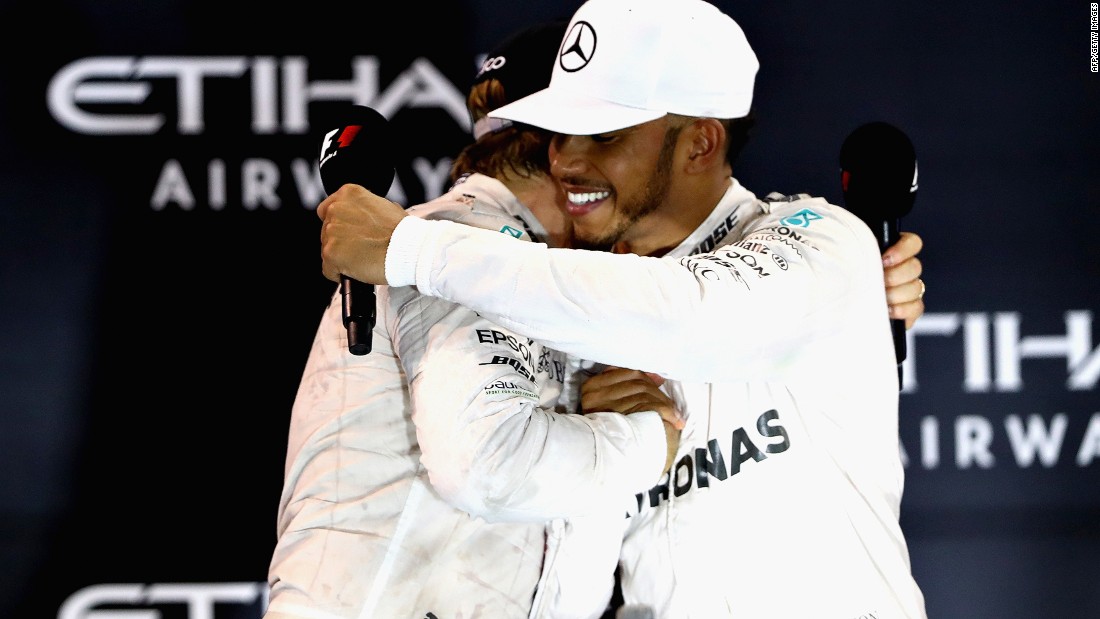 Rosberg and Hamilton embrace on the podium -- hostilities over for another season. 