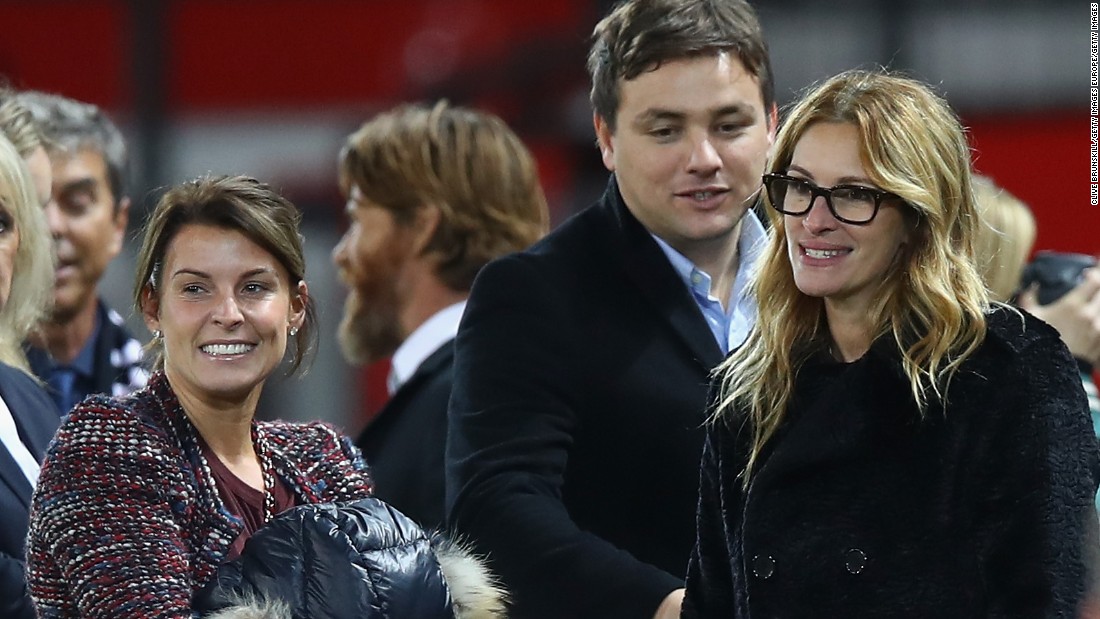 She chatted to Coleen Rooney (left), wife of the England and Manchester United captain Wayne Rooney. 