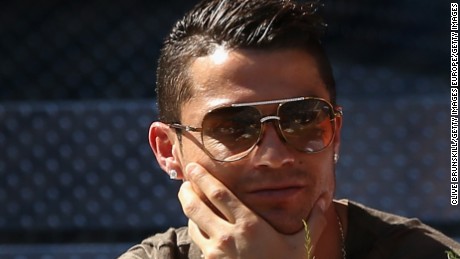 Cristiano Ronaldo of Real Madrid watches Rafael Nadal of Spain in action against Simone Bolelli of Italy in their third round match during day six of the Mutua Madrid Open tennis tournament at the Caja Magica  on May 7, 2015 in Madrid, Spain.  