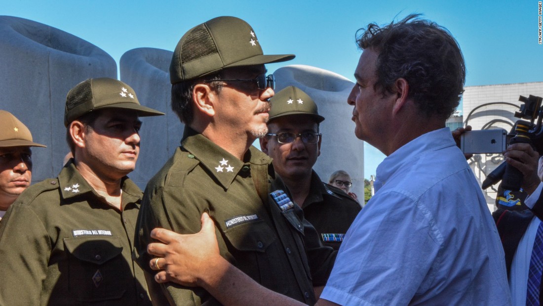 Alejandro Castro Espin, son of Cuban President Raul Castro, offers his condolences to his cousin Antonio Castro Soto del Valle, right, at Revolution Square.