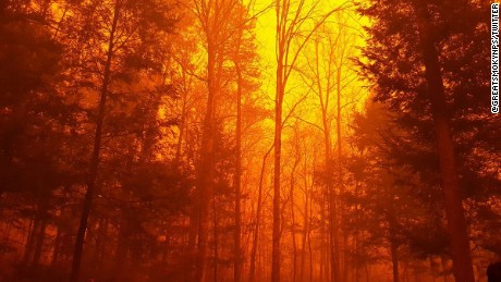 Fanned by strong winds and the Southeast&#39;s worst drought in nearly a decade, at least 14 fires burned in and around Gatlinburg, Tennessee, forcing evacuations from the popular tourist gateway and nearby communities. On Monday afternoon, a wildfire from the Great Smoky Mountains National Park spread rapidly into communities around it. By early Tuesday, emergency officials said about 100 homes were affected by the blaze.