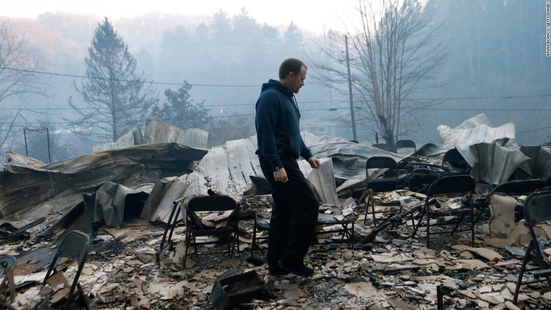 Trevor Cates inspects the damage to the Banner Missionary Baptist Church in Gatlinburg on November 29.