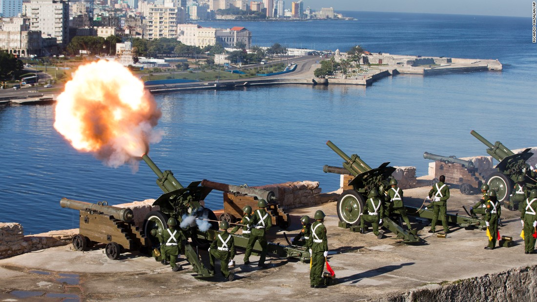 An honor guard fires a 21-gun salute to mark the start of services paying tribute to Castro in Havana on Monday, November 28. 