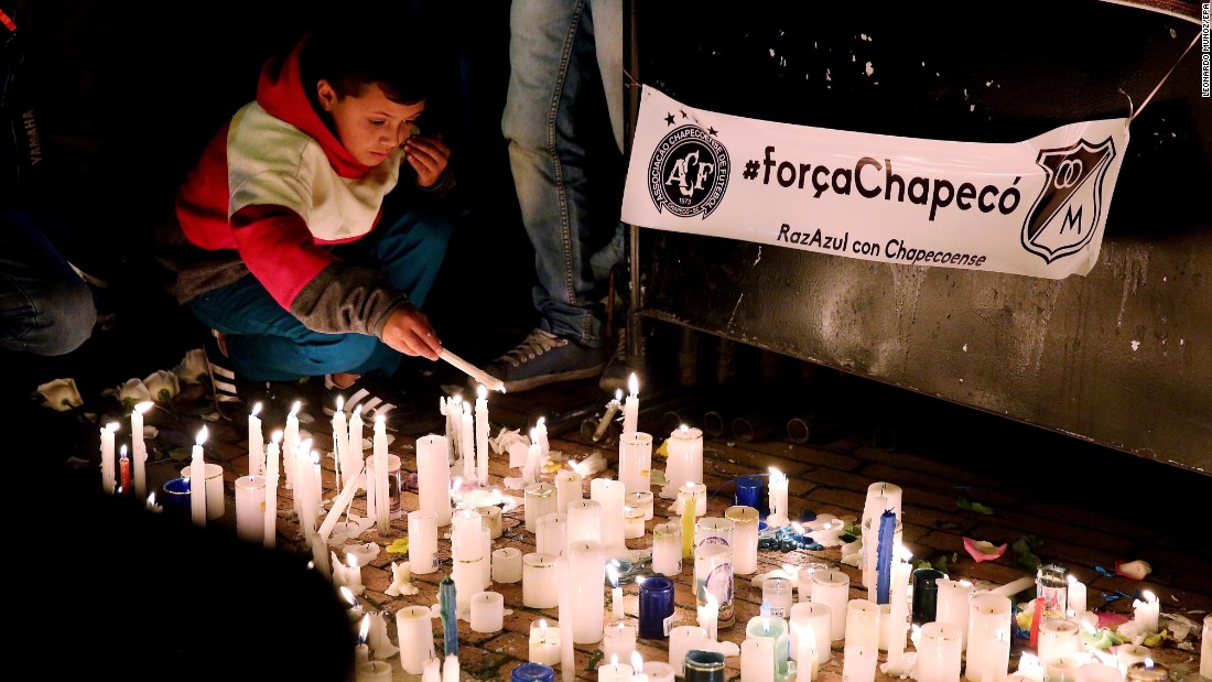 People attend a candlelight vigil in Bogota, Colombia, on November 29.