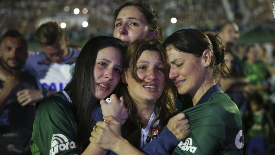 Relatives of Chapecoense soccer players cry during the tribute on November 30.