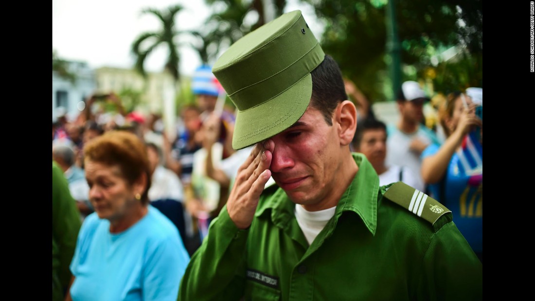 A soldier reacts after the ashes of longtime Cuban leader Fidel Castro passed through Santa Clara, Cuba, on Thursday, December 1. 