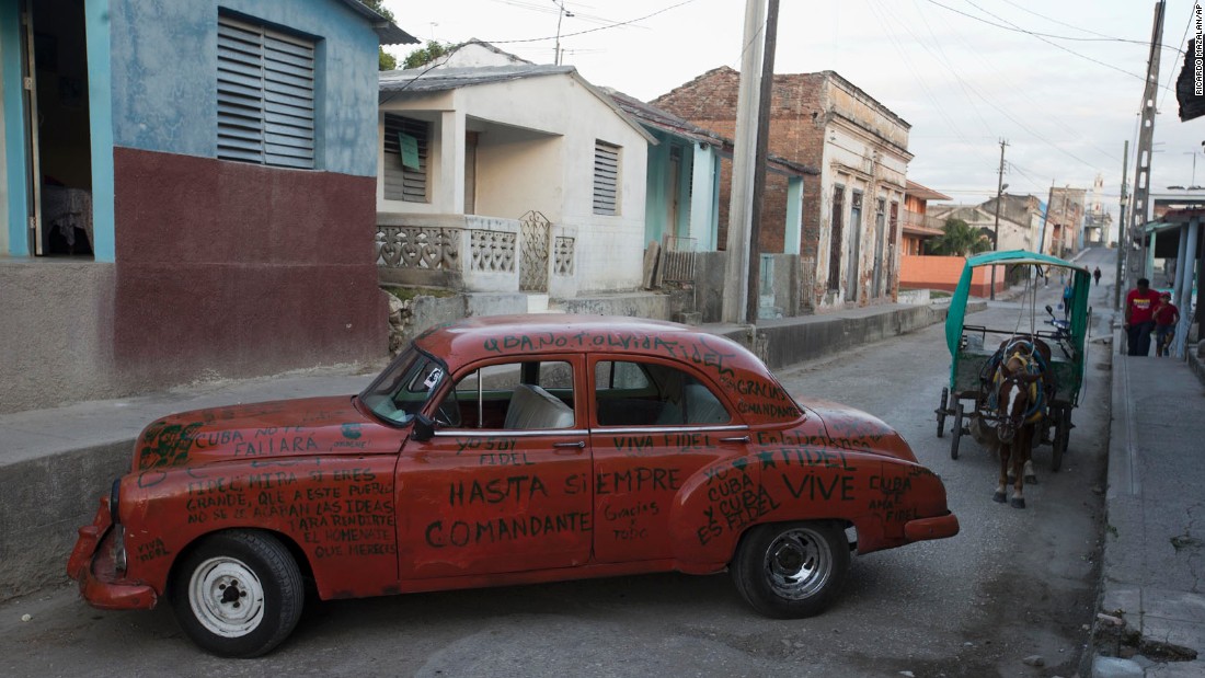 A car adorned with messages to Castro sits parked on a street in La Esperanza, Cuba, on Wednesday, November 30.