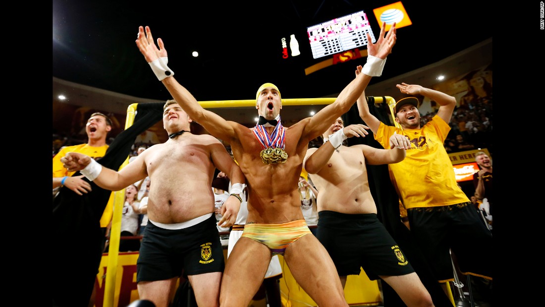 Olympic legend Michael Phelps helps Arizona State students try to distract a free-throw shooter during a college basketball game on Thursday, January 28. The Oregon State shooter missed both of his shots after Phelps &lt;a href=&quot;http://bleacherreport.com/articles/2612010-michael-phelps-pops-out-of-asus-curtain-of-distraction-to-distract-ft-shooter&quot; target=&quot;_blank&quot;&gt;popped out of the &quot;Curtain of Distraction.&quot;&lt;/a&gt;