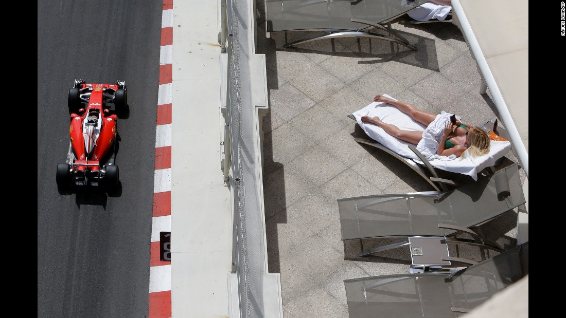 A woman sunbathes during a Formula One practice session in Monaco on Thursday, May 26.