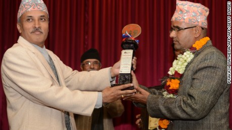 Nepalese civil servant Gyan Mani Nepal receives the inaugural Integrity Idol trophy for 2014.