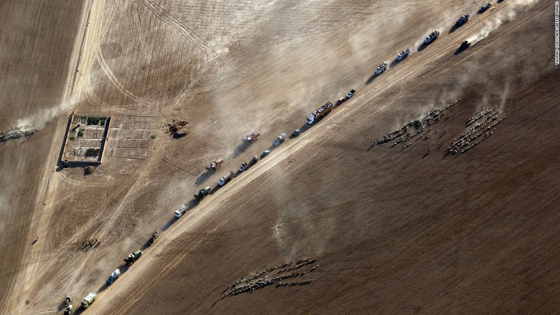 Displaced civilians return to the village of Tall Abtah on Friday, November 25, after Iraqi forces retook the village from ISIS.