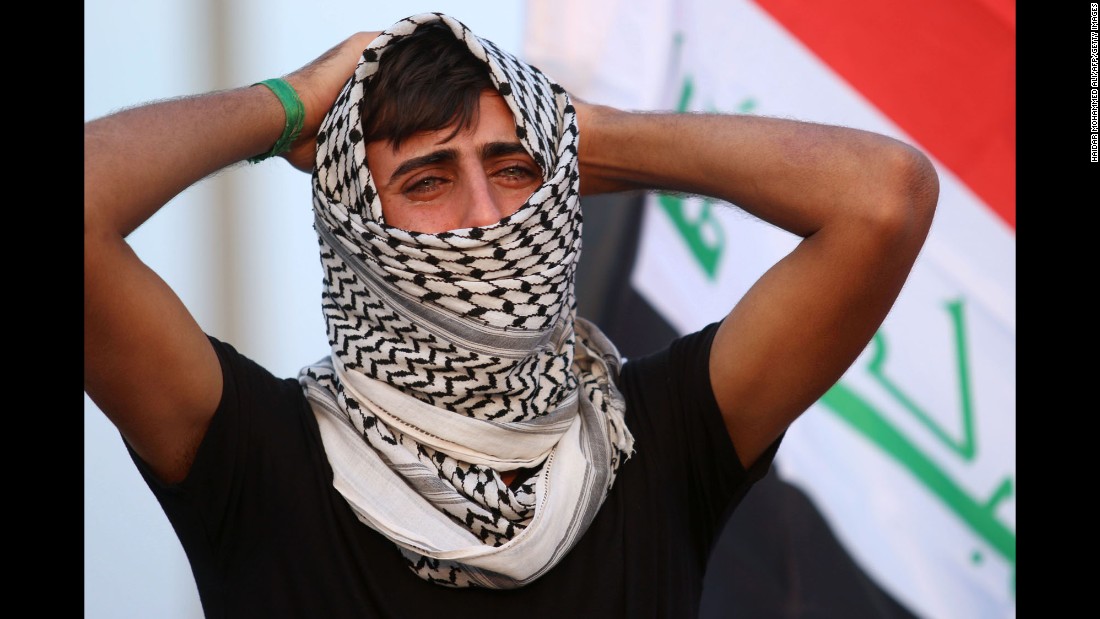 A man mourns during the funeral of four Iraqi paramilitary fighters who were killed in battles in the town of Tal Afar.