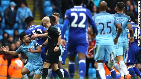 Players from both sides get involved after Sergio Aguero (left) is about to be shown a red card for his challenge on David Luiz of Chelsea. 