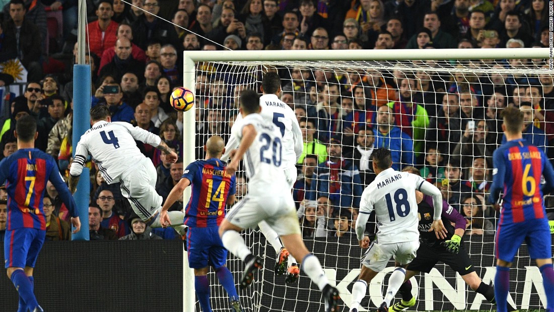 Ramos (No.4) heads the late equalizer for Los Blancos in El Clasico. 