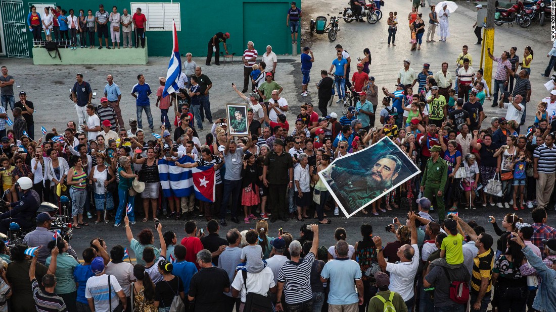 Cubans see the ashes of Fidel Castro being carried by a special convoy through the city of Holguin on Saturday, December 3. 