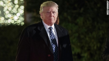 President-elect Donald Trump looks toward reporters as he arrives for a party at the home of Robert Mercer, one of his biggest campaign donors, Saturday, December 3, 2016, in Head of the Harbor, New York.