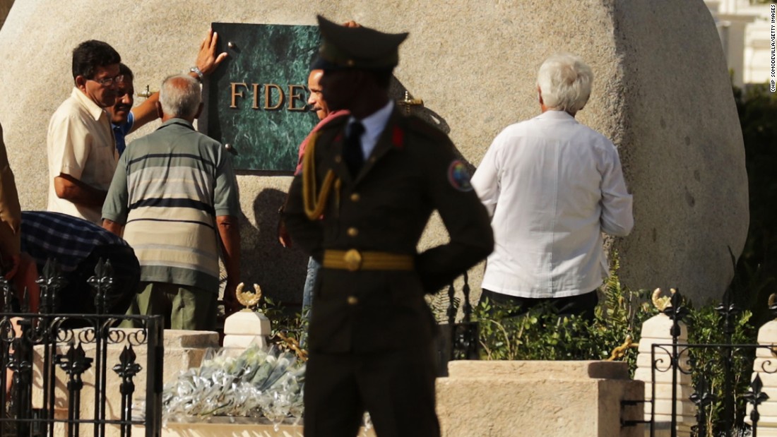 Workers place a plaque with the word &quot;Fidel&quot; on the tomb holding the remains of former Cuban President Fidel Castro in the Cementerio Santa Ifigenia where he was buried, Sunday, December 4, in Santiago de Cuba. Cubans &lt;a href=&quot;http://www.cnn.com/2016/11/27/world/fidel-castro-funeral-reaction/&quot; target=&quot;_blank&quot;&gt;are honoring his life&lt;/a&gt; this week.